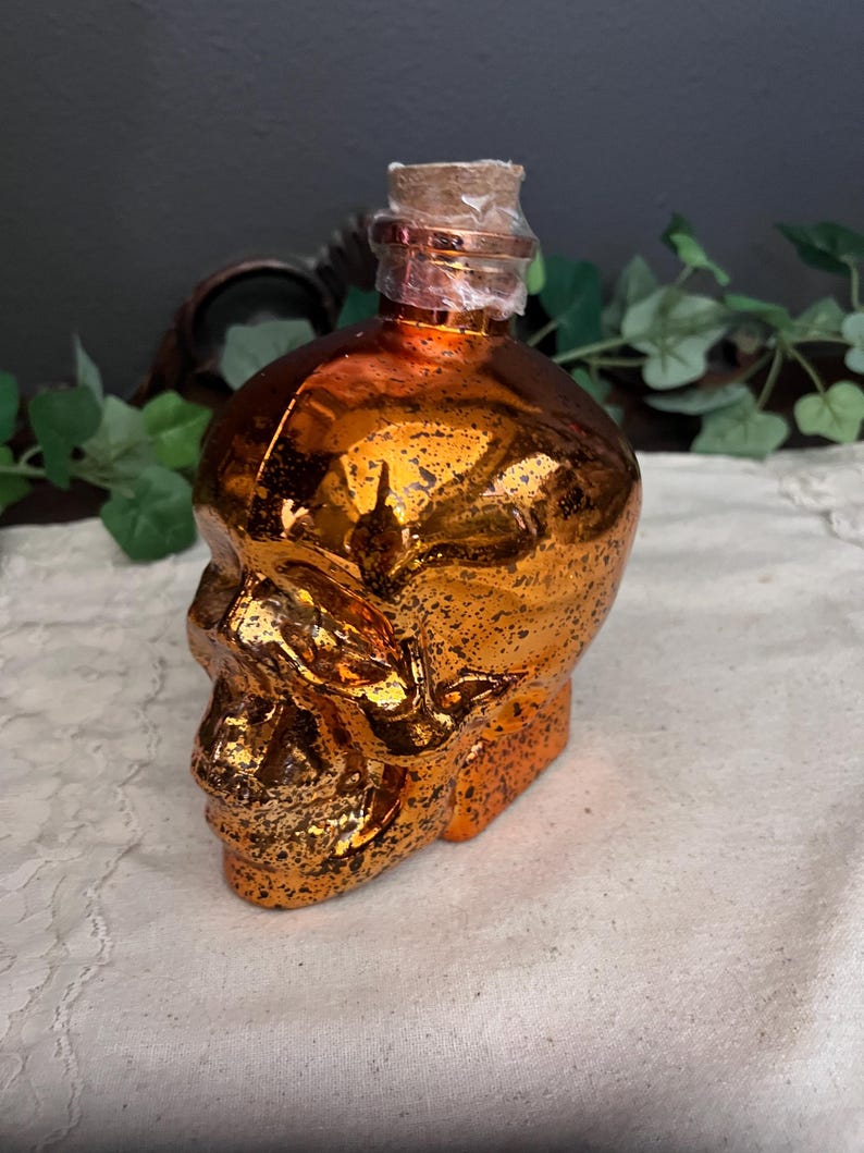 Green lighted glass skull jar