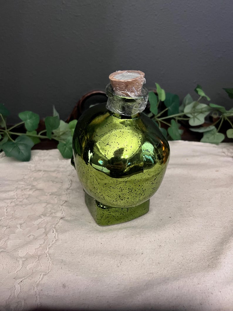 Green lighted glass skull jar