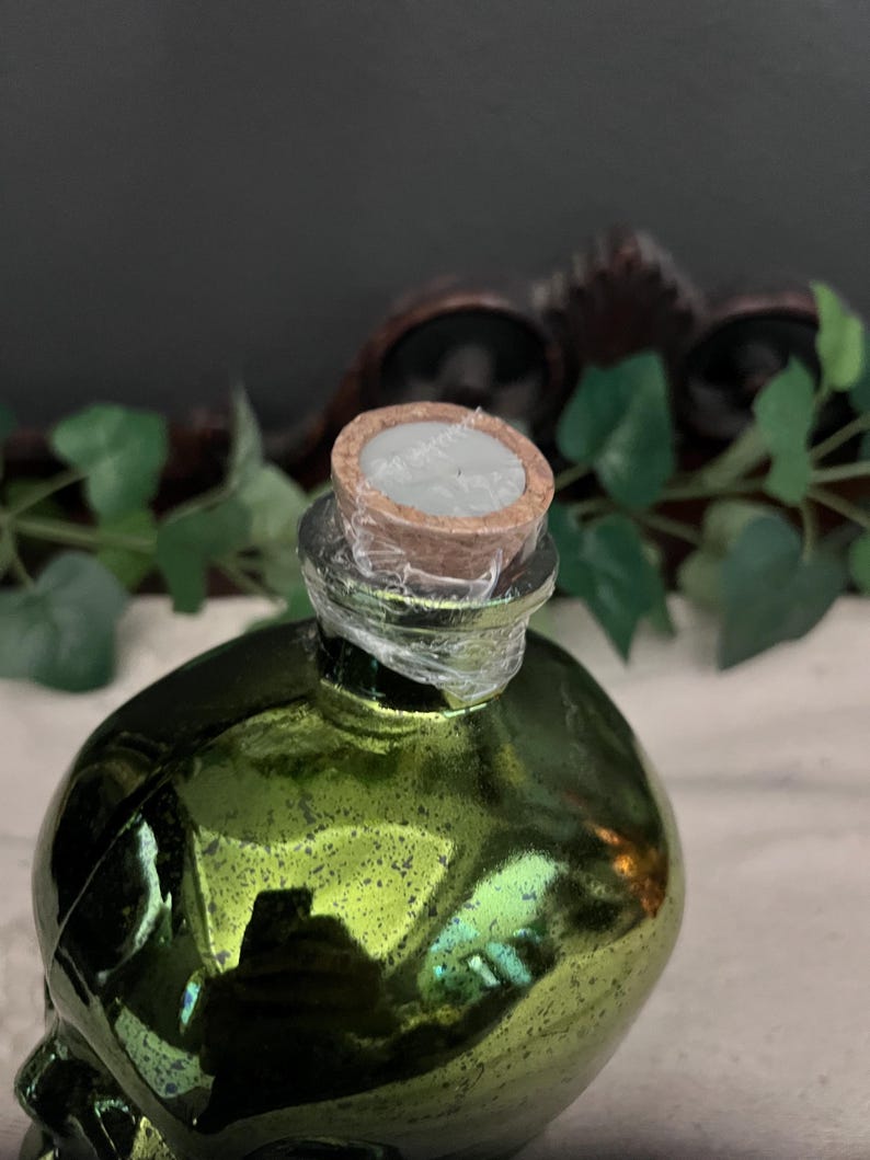 Green lighted glass skull jar