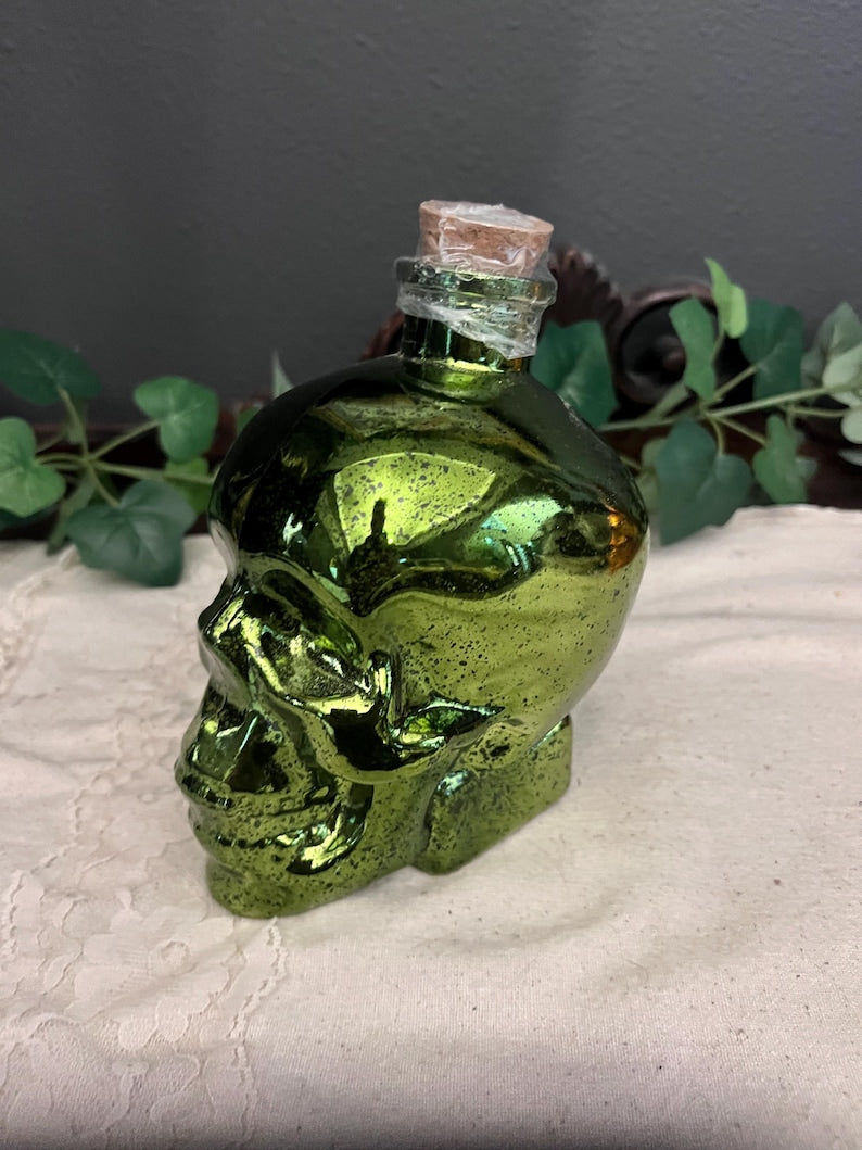 Green lighted glass skull jar
